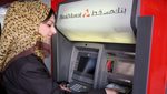 A customer uses a Bank Muscat ATM. Banks in Oman recorded a 15 percent rise in profits in 2024