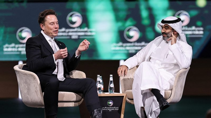 SpaceX and Tesla CEO Elon Musk speaks with Saudi minister of communications Abdullah Alswaha at the Saudi-US Investment Forum in Riyadh