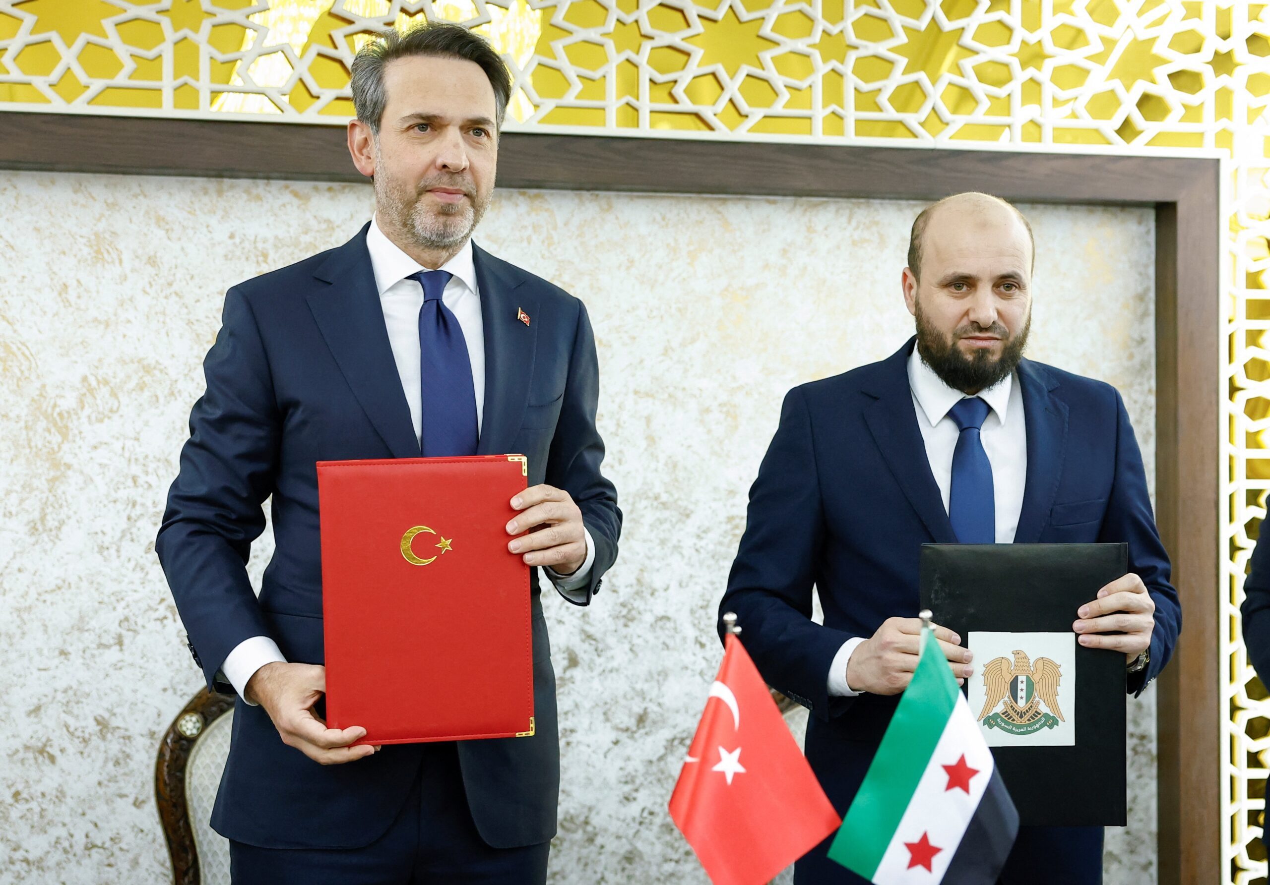 Syrian energy minister Mohammed Al-Bashir attends a press conference with Turkish energy minister Alparslan Bayraktar in Damascus, Syria