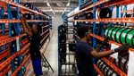 Workers at a fibre optic cable production facility. Syria plans to spend up to $300 million to improve its communications network